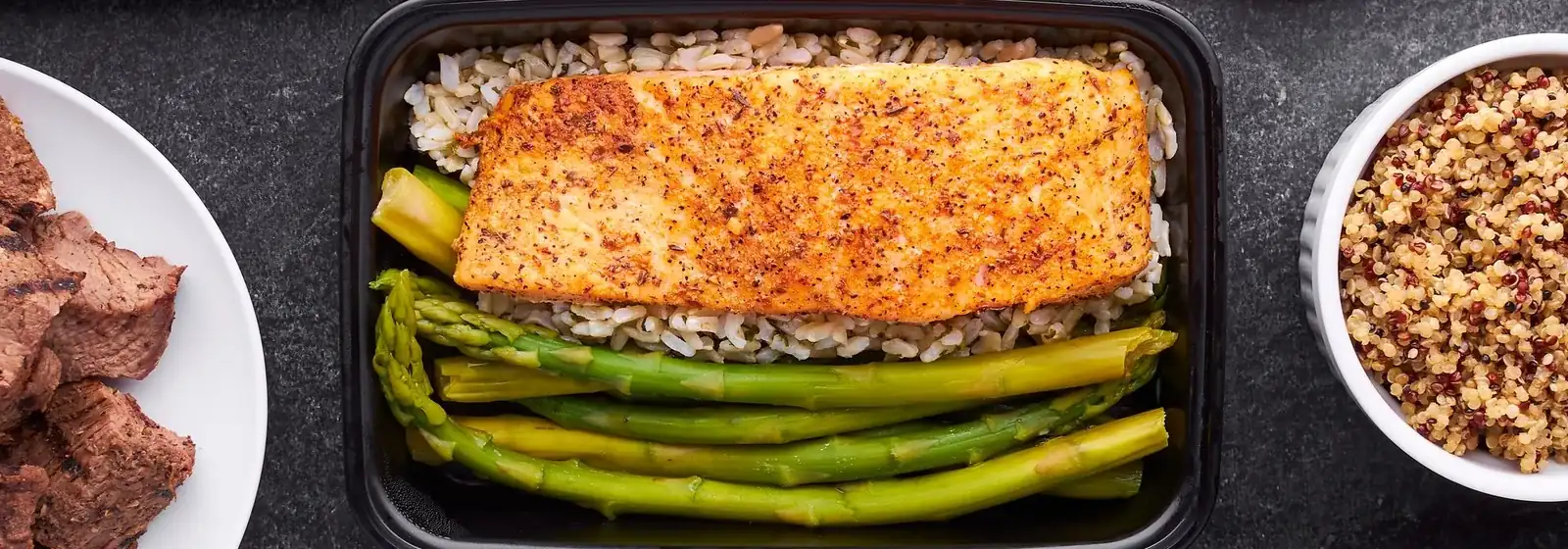 Balanced prepared meals: salmon, asparagus and whole grains